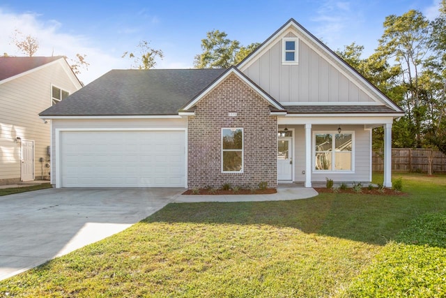 view of front of home with a garage and a front lawn