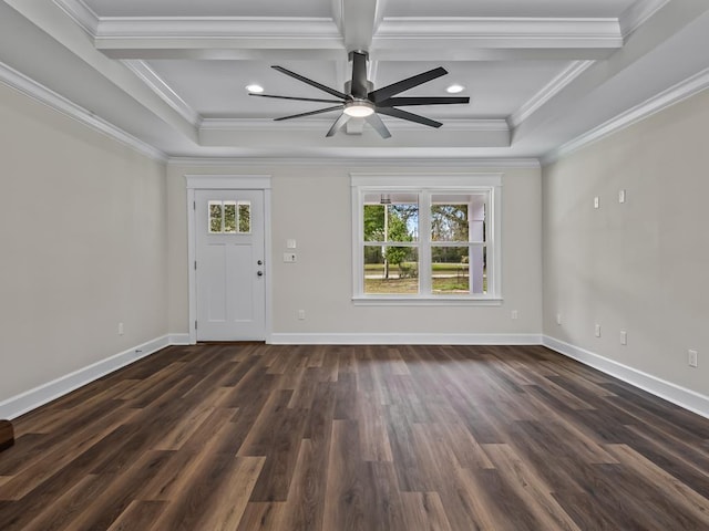 entrance foyer with crown molding, a tray ceiling, dark wood-type flooring, and baseboards