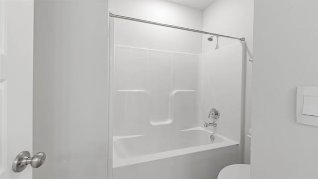 bathroom featuring toilet and shower / washtub combination