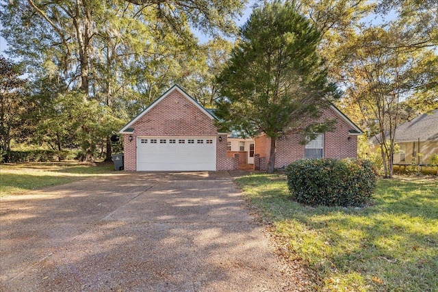 view of front of house featuring a garage and a front lawn