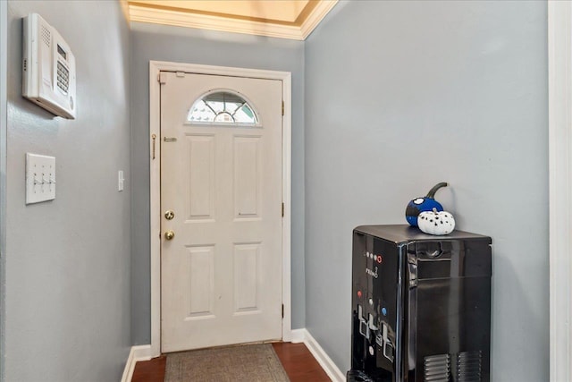 entrance foyer with hardwood / wood-style floors and crown molding