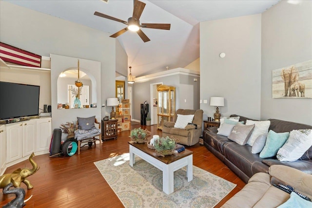 living room featuring ceiling fan, lofted ceiling, and dark wood-type flooring