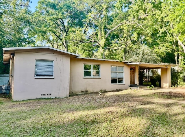 1402 W Tharpe St, Tallahassee, FL 32303 - ranch-style home featuring a front yard, stucco siding, and crawl space