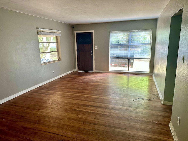 1402 W Tharpe St, Tallahassee, FL 32303 - foyer with wood finished floors and a textured wall