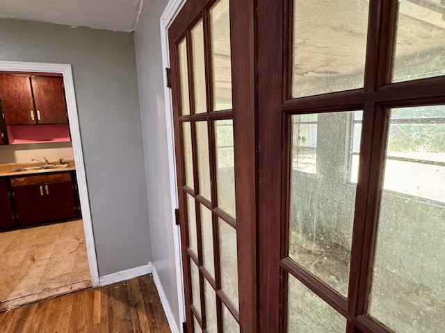 1402 W Tharpe St, Tallahassee, FL 32303 - doorway with a sink and wood finished floors