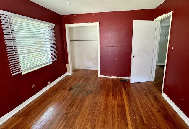 1402 W Tharpe St, Tallahassee, FL 32303 - unfurnished bedroom featuring hardwood / wood-style flooring and a closet