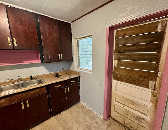 1402 W Tharpe St, Tallahassee, FL 32303 - kitchen featuring light countertops and dark brown cabinetry