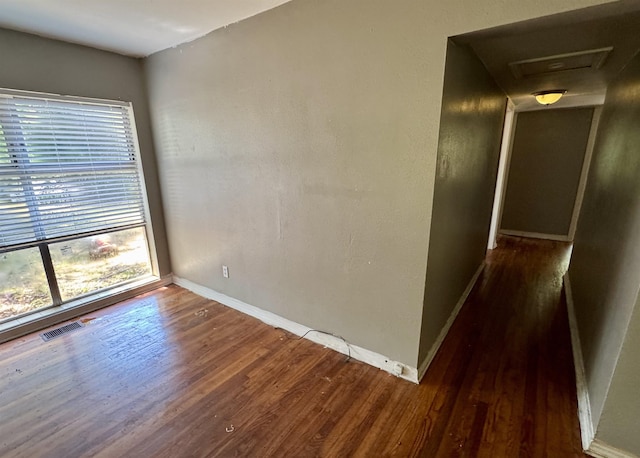 1402 W Tharpe St, Tallahassee, FL 32303 - empty room with wood finished floors and attic access