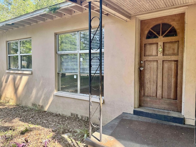 1402 W Tharpe St, Tallahassee, FL 32303 - view of exterior entry featuring stucco siding