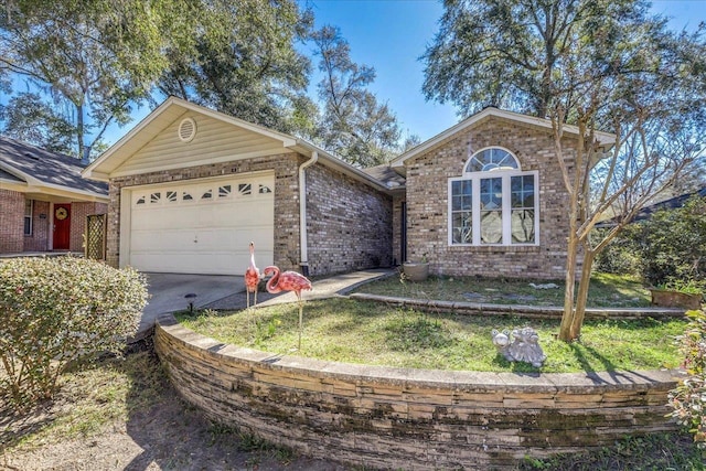 single story home featuring a garage, driveway, and brick siding