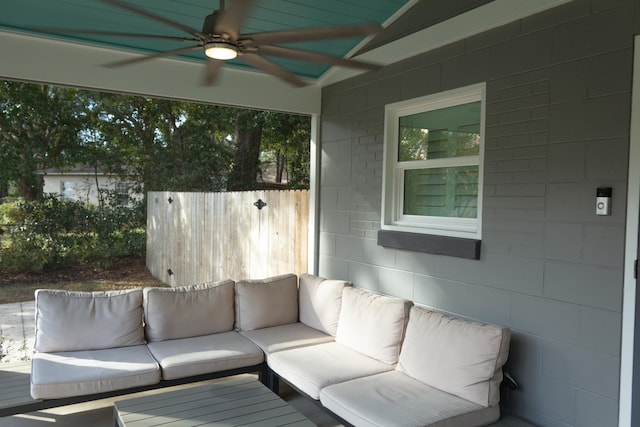 unfurnished sunroom with vaulted ceiling and ceiling fan