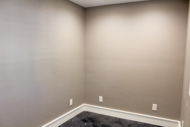 spare room featuring concrete floors