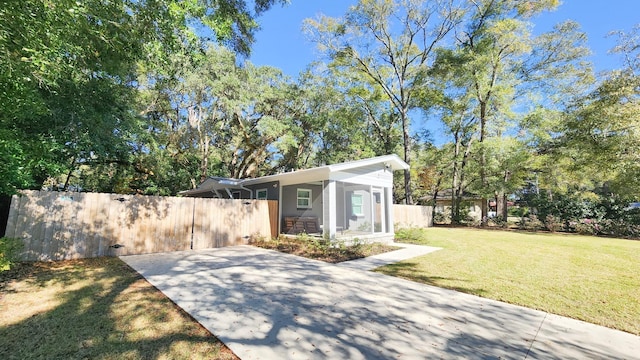 exterior space featuring a front lawn