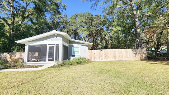 view of yard featuring a sunroom