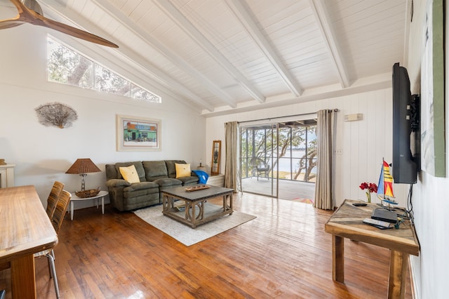 living room featuring ceiling fan, beam ceiling, hardwood / wood-style floors, and high vaulted ceiling