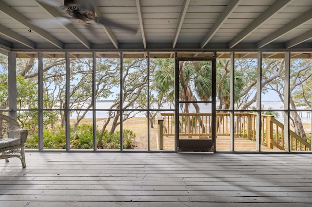 unfurnished sunroom with ceiling fan