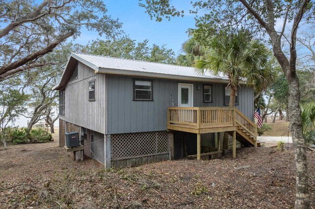 rear view of house featuring a deck and central AC unit