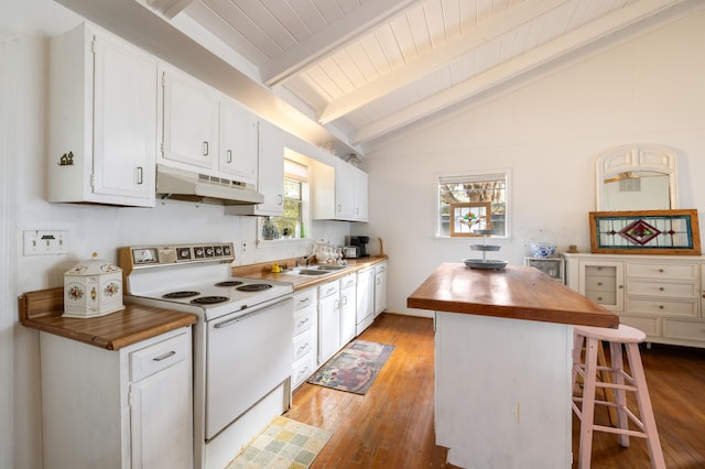 kitchen featuring wooden counters, lofted ceiling with beams, a kitchen bar, white cabinetry, and white range with electric cooktop