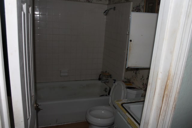 full bath featuring shower / bath combination, a sink, and toilet