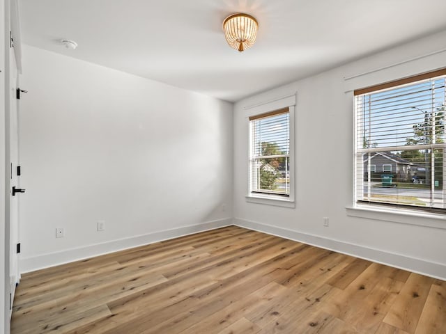 unfurnished room with light hardwood / wood-style floors