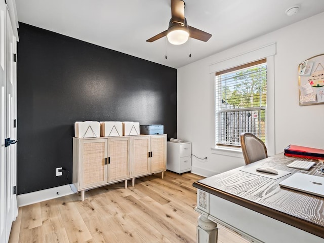 office with ceiling fan and light wood-type flooring