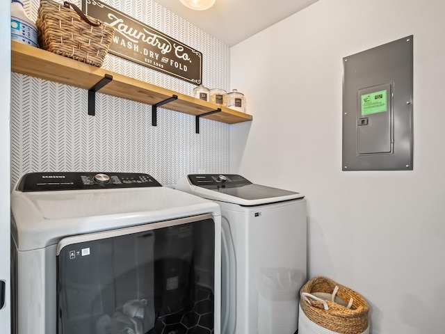 laundry area featuring electric panel and independent washer and dryer