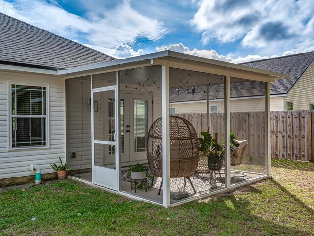 view of patio with a sunroom