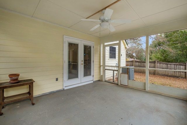 unfurnished sunroom featuring french doors and ceiling fan