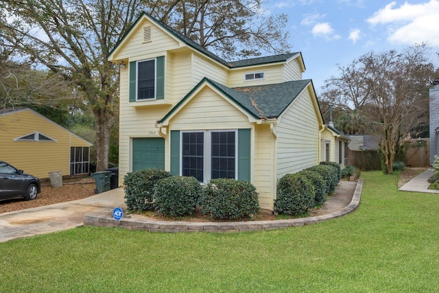 view of front of property with fence, concrete driveway, a front yard, a shingled roof, and a garage