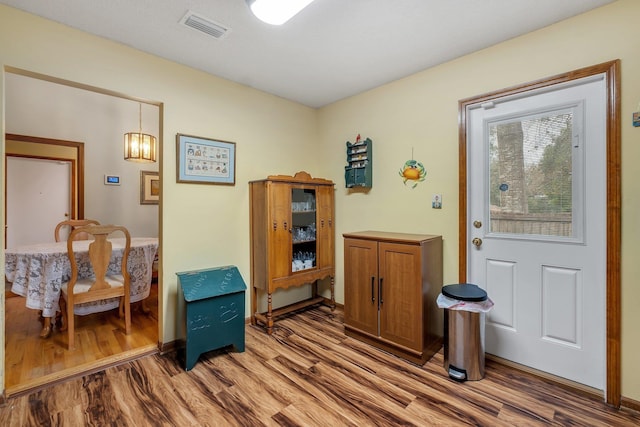 entrance foyer with visible vents and light wood-style floors