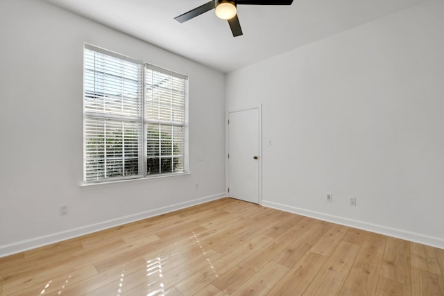 unfurnished room with light wood-type flooring and ceiling fan