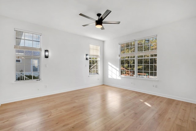 unfurnished room featuring ceiling fan and light wood-type flooring