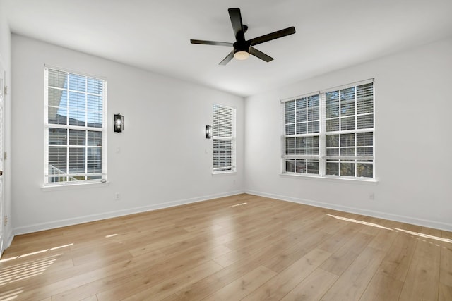 empty room with ceiling fan and light wood-type flooring