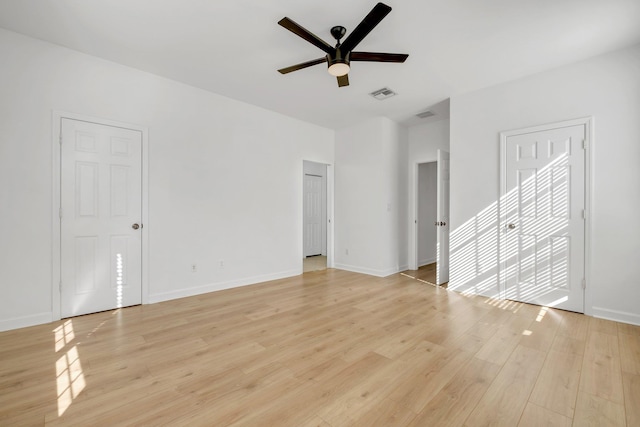 spare room featuring ceiling fan and light hardwood / wood-style flooring