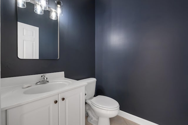 bathroom with tile patterned floors, vanity, and toilet