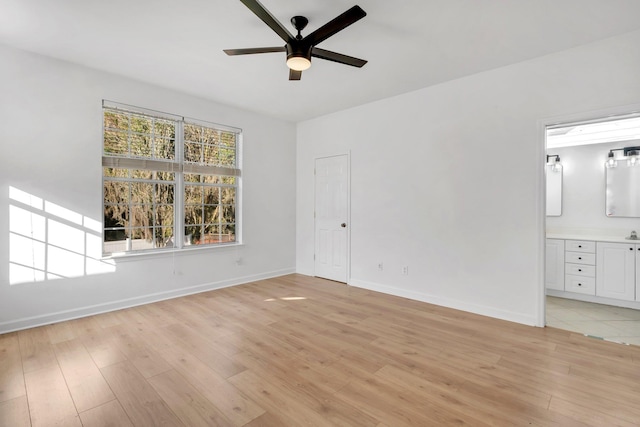 interior space featuring light wood-type flooring and ceiling fan