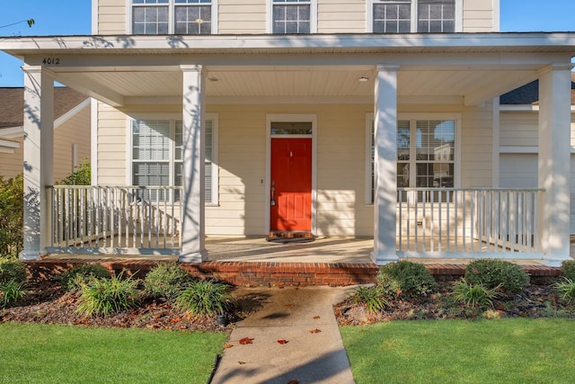 doorway to property featuring covered porch