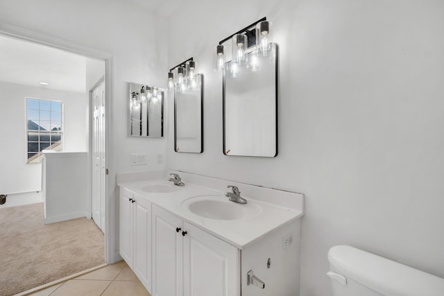 bathroom with tile patterned floors, vanity, and toilet