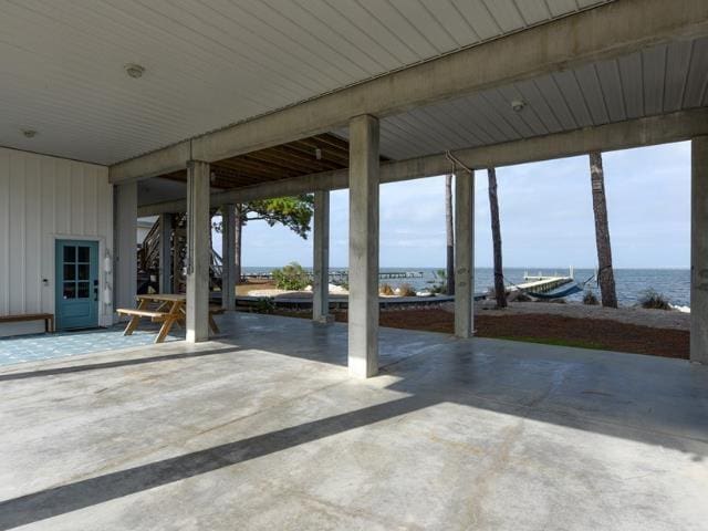 view of patio with a water view