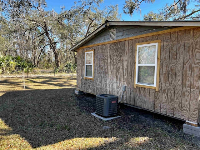 view of side of home with cooling unit