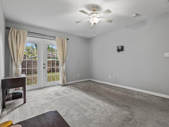 31 Sioux Trl, Crawfordville, FL 32327 - carpeted empty room with french doors, ceiling fan, and a smoke detector