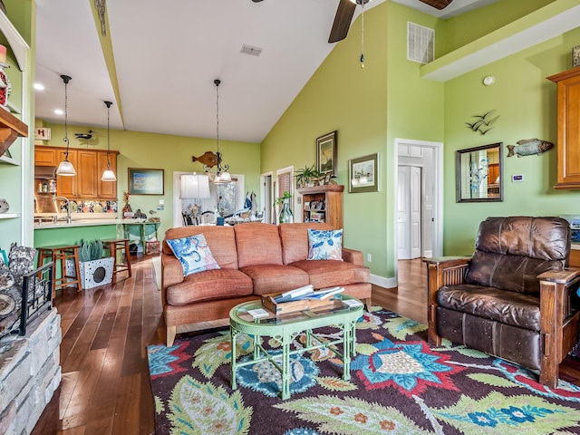 living room with sink, dark wood-type flooring, high vaulted ceiling, and ceiling fan