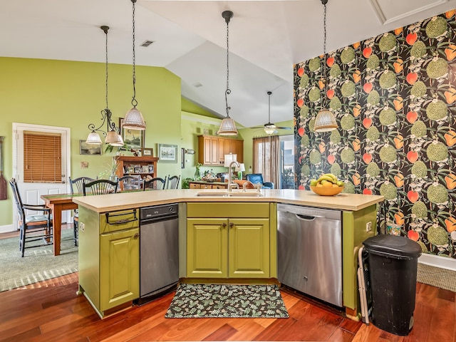 kitchen featuring sink, dishwasher, a kitchen island with sink, and hanging light fixtures