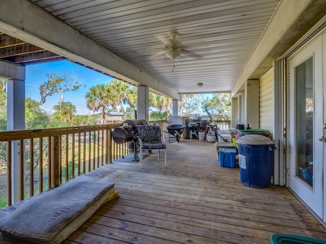 wooden terrace featuring ceiling fan