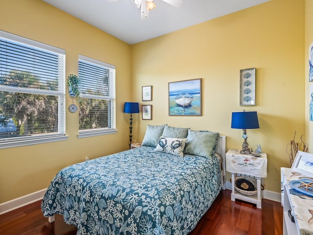 bedroom featuring ceiling fan and dark hardwood / wood-style floors