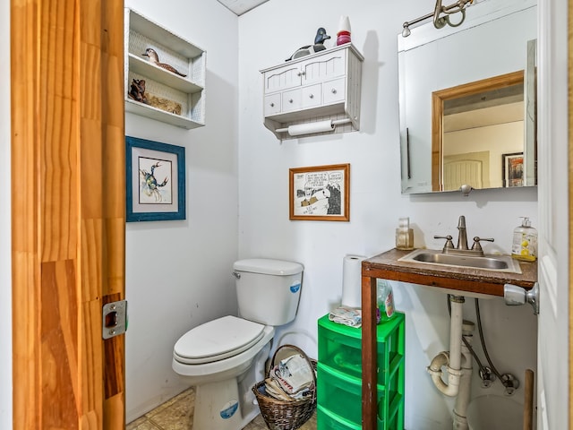 bathroom with sink and toilet