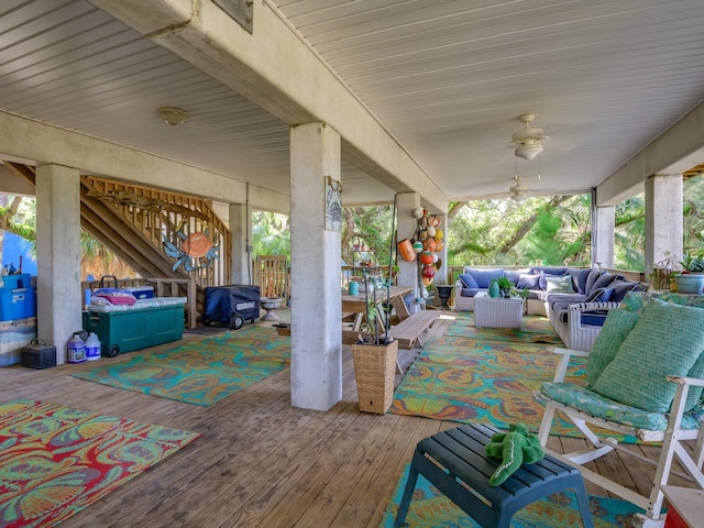 view of patio / terrace with ceiling fan, an outdoor living space, and a deck