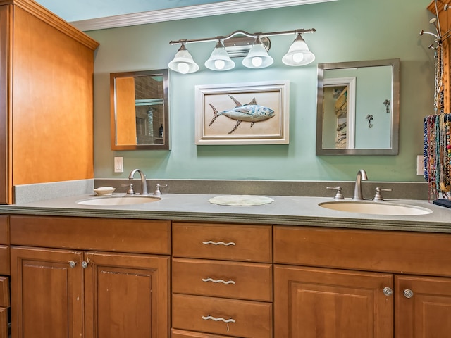 bathroom with ornamental molding and vanity