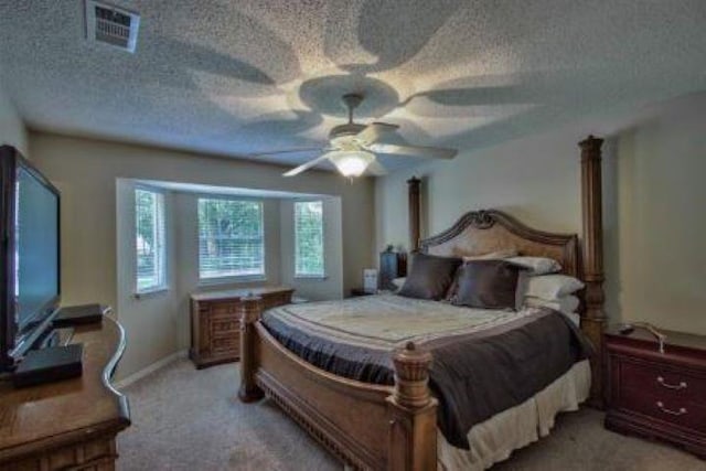 bedroom with ceiling fan and light colored carpet