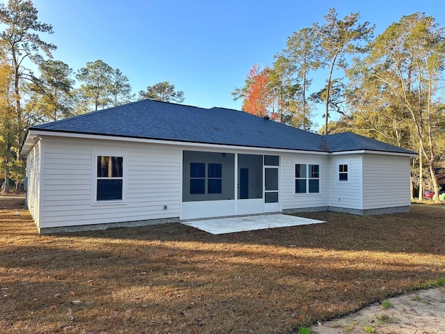 2725 Masterson Ln, Tallahassee, FL 32311 - back of property featuring a patio, a shingled roof, a lawn, and a sunroom